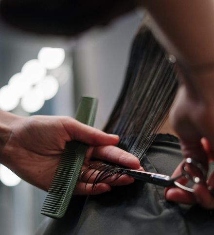 Person Holding Black Hair Comb